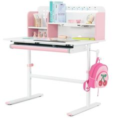 a pink and white desk with a backpack on it's lap top next to a book shelf