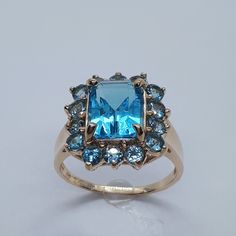 This stunning blue topaz ring has been carefully crafted in warm yellow gold and authentic blue topaz. This ring would make a great any occasion/birthday gift! This ring will not go unnoticed. All of my jewelry is handmade from scratch and of high quality. A tracking shipping number will be provided to you once the ring has been mailed. Ring measurements and materials: Ring is size 6 1/4 but can be resized at no extra cost and will be shipped to you in an elegant gift box. Ring Weight: 4.0 grams Luxury Victorian Topaz Ring Gift, Luxury Unique Topaz Ring As Gift, Luxury Vintage Topaz Ring As A Gift, Luxury Vintage Topaz Ring Collectible, Vintage Luxury Topaz Collectible Ring, Luxury Elegant Topaz Ring With Large Stone, Luxury Octagon Topaz Jewelry, Luxury Gold Heirloom Topaz Ring, Box Ring