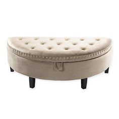 a round bench with wooden legs and buttons on the top, sitting in front of a white background