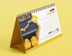 a yellow desk calendar with shoes on display