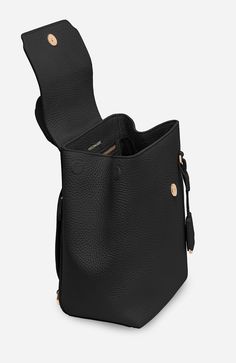 a black leather bag with two compartments and one compartment open to show the inside of it