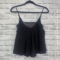 Free People Black Spaghetti Strap Top With Sequins Bralette Attached. Perfect For Going Out Or Just A Cute Top For Warmer Weather. Black Stretch Camisole For Summer, Black Stretch Camisole For Party, Black Tank Top With Built-in Bra For Summer, Black Stretch Camisole For Night Out, Stretch Black Camisole For Night Out, Summer Stretch Camisole For Night Out, Summer Evening Tank Top With Built-in Bra, Summer Evening Camisole With Built-in Bra, Evening Tank Top With Built-in Bra For Summer