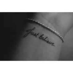 a woman's wrist tattoo with the words just believe on her left arm and an inscription