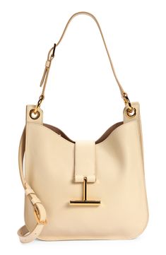 Signature T-shaped hardware brings discreet branding to an iconic Tom Ford top-handle bag crafted of beautifully grained leather. A detachable strap that easily converts for shoulder to crossbody wear offers another carrying option for styling versatility. Magnetic-snap tab closure Adjustable top-carry handle; removable, adjustable shoulder strap Interior zip pocket Lined Leather Made in Italy Designer Handbags Tan Calf Leather Shoulder Bag With Branded Hardware, Tan Shoulder Bag With Palladium Hardware In Calf Leather, Tan Calf Leather Shoulder Bag With Palladium Hardware, Timeless Tan Shoulder Bag With Gold-tone Hardware, Tan Calf Leather Shoulder Bag For Office, Chic Calf Leather Shoulder Bag With Branded Hardware, Chic Business Bucket Bag With Gold-tone Hardware, Chic Bucket Bag With Gold-tone Hardware For Business, Workwear Shoulder Bag With Gold-tone Hardware And Round Handle