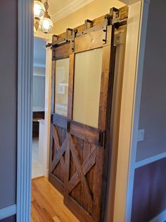 an open barn door in the middle of a room