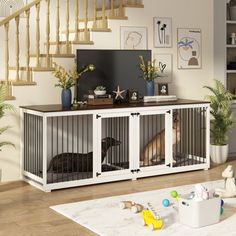 a dog is sitting in his cage on the floor next to stairs and a television