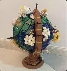 a sculpture made out of legos and flowers