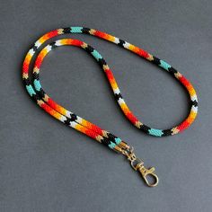 Elevate your style with this Native-inspired teacher lanyard. Handmade Southwestern beaded lanyard, perfect for holding ID cards, keys, and badges with elegance. ☑️ **Stylish and Functional Design**   This Native-inspired teacher lanyard blends style and utility. Its colorful beadwork complements any outfit while securely holding ID cards, keys, or badges. - Native-inspired beads in vibrant colors   - Secure clasp for easy attachment of essentials   - Versatile for both classroom and office use Southwestern Aesthetic, Badges Design, Beaded Lanyard, Teacher Lanyard, Beaded Lanyards, Eyeglass Holder, Stylish Gifts, Badge Holders Lanyard, Accessories Unique