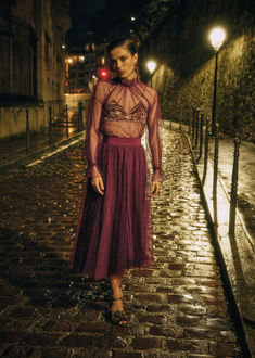 The Sézane Masha Skirt and Dantes Blouse in burgundy plumetis create a romantic, elevated co-ord perfect for winter occasions. The Masha Skirt features a flowing plumetis tulle design with a wide grosgrain waistband and concealed side zip for a flattering fit. The Dantes Blouse pairs transparent polka-dot tulle with a gathered stand-up collar and velvet tie fastening. Style this duo with heeled boots or flats for chic Parisian elegance. Explore our collection now at sezane.com or via the app. Christmas Wishlist, Co Ord, Parisian Style, Black Satin, Velvet, Satin, Mini Dress, Festival, Skirt