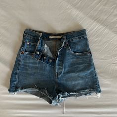 Never Worn, But Washed Once Shorts Run Extremely Small And Fit More Like A 23 Or 24 Rather Than 825 Levi's Summer Jean Shorts With Button Closure, Levi's Jean Shorts With Button Closure, Levi's Casual Shorts With Button Closure, Levi's Button Closure Jean Shorts, High Rise Bottoms With Belt Loops For Day Out, Mid-rise Bottoms With Buttons For Day Out, High Waist Blue Levi's Shorts, Levi's High Waist Blue Shorts, Trendy Cutoff Shorts With Buttons