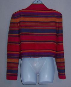 "Vintage Emanuel Ungaro hot pink, red, blue, and purple striped stripes Southwest serape style fringed wool jacket, blazer or coat. Excellent pre-owned condition. No holes, stains, rips, tears, etc. Women's size 12 or 46. Measurements: bust-46\", length-19\", waist-34\". Lined. Button front. 69% wool, 20% acrylic, 11% cotton. One button closure. Bright and fun!" Fitted Multicolor Wool Outerwear, Striped Long Sleeve Blazer For Fall, Fitted Striped Wool Outerwear, Striped Long-sleeved Wool Blazer, Striped Wool Blazer With Long Sleeves, Fall Striped Wool Blazer, Striped Wool Blazer For Fall, Striped Long Sleeve Winter Blazer, Striped Long Sleeve Blazer For Winter