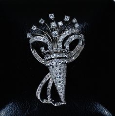 "Absolutely stunning Art Deco era platinum and 124 excellent quality diamonds Tremblant brooch! The bouquet diamonds are set in an articulated \"tremblant\" setting. The brooch comes in its original fitted leather and velvet case. Measurements: 2 diamonds diameter 3mm (0,11\") 8 diamonds diameter 2,25mm (0,08\") 4 diamonds diameter 2mm (0,07\") 108 diamonds diameter 1,5mm (0,05\") Total carat weight is approximately 1.72 carats approximate width 3,5cm (1,37\") Approximate height 5,5cm (2,16\") t Classic Diamond Brilliant Cut Brooch, Classic Diamond Brooch With Brilliant Cut, Classic Diamond Brooches With Brilliant Cut, Formal Diamond White Brilliant Cut Brooch, White Gold Diamond Brooch With Brilliant Cut, Diamond Brooches In Brilliant Cut White Gold, Fine Jewelry Diamond Brooch With Brilliant Cut, Diamond Brooch With Brilliant Cut, Diamond White Brooch With Diamond Accents