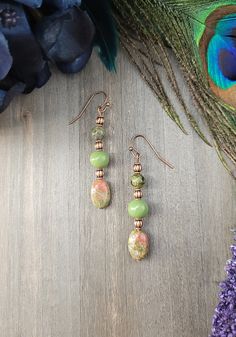 Embrace your boho spirit with our Copper & Unakite Earrings. Earthy olive & peach hues mingle in perfect harmony, creating a mesmerizing dangle that whispers stories of forests & sunsets. A treasure for bohemian souls, these earrings add an ethereal touch to any outfit. Let nature inspire your style. You will love wearing these unique earrings with any outfit whether casual or dressy. All of my jewelry creations come in a beautiful satin drawstring bag perfect for gift giving. E101 Green Bohemian Jewelry For Healing, Earthy Green Jewelry For Festivals, Green Teardrop Bohemian Jewelry, Bohemian Green Teardrop Jewelry, Green Handmade Bohemian Earrings, Green Bohemian Handmade Earrings, Green Bohemian Beaded Drop Earrings, Bohemian Green Earrings For Festival, Bohemian Green Beaded Drop Earrings