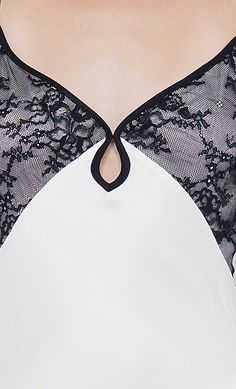 the back of a woman's bra with black and white lace