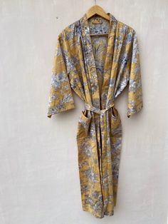 This Robe we makes from 100% Cotton printed fabric.The fabric print is Anokhi Floral which is very popular in all over the world .We use pure cotton cambric fabric .This is free One size robe .There is both side pocket in robe.Length = 120 cms. ( 48 inches) Printed Robe, Floral Robes, Cotton Kimono, Hand Block Print, Night Wear, Block Printing Fabric, Swim Wear, Indian Cotton, Fabric Print