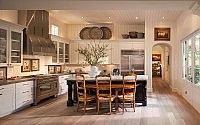 a large kitchen with wooden floors and white cabinets