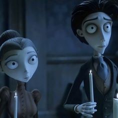 two animated characters holding candles in front of each other with eyes wide open and looking at the camera