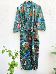 This Robe we makes from 100% Cotton printed fabric. The fabric print is Floral which is very popular in all over the world . We use pure cotton cambric fabric . This is free One size robe . There is both side pocket in robe. Length = 120 cms. ( 48 inches) Green Floral Print Sleepwear For Summer, Green Summer Sleepwear For Home, Green Printed Long Sleeve Sleepwear, Green Long Sleeve Sleep Dress, Summer Green Kimono For Loungewear, Green Cotton Dress With Kimono Sleeves, Green Kimono Sleeve Robe For Summer, Green Summer Robe With Kimono Sleeves, Summer Green Robe With Kimono Sleeves