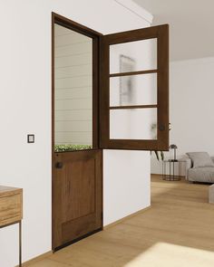 an open wooden door leading to a living room