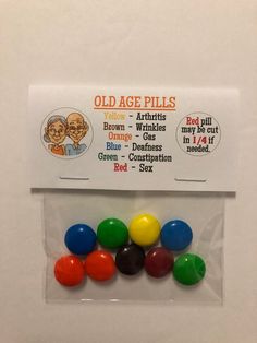 an old age pill pack with six different colored balls in the front and one on the back