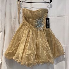 Absolutely Stunning Strapless Pleated Empire Waist Gold Sherri Hill Dress Size 8 Comes With Straps That Can Be Sewn On If Desired Gold Mini Dress With Sweetheart Neckline For Party Season, Gold A-line Evening Dress For Cocktail, Gold Strapless Dress For Summer Evenings, Gold A-line Evening Dress For Cocktail Events, Strapless Champagne Dress For Party Season, Gold Strapless Dress For Spring Evening, Gold Strapless Dress For Evening In Spring, Gold A-line Cocktail Evening Dress, Gold Strapless Mini Dress For Cocktail