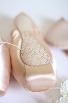 the bride's wedding shoes are on display