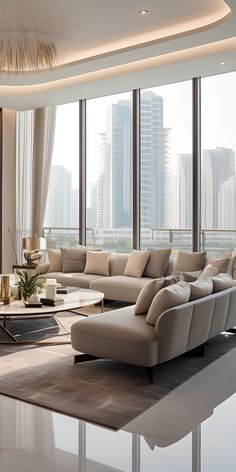 a modern living room with large windows and couches in front of the cityscape