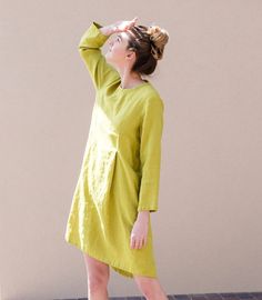 Handcrafted Oeko-Tex Standard certified 100% European linen smock dress ideal for everyday wear. Perfect for springtime or chilly summer days. Always dress to kill! Neckline: round Silhouette: A-line Length: ±44"/110cm (we can make adjustments) Sleeve length: 3/4 Pockets: side seam Details: *Colour shown:  pear green / forest green *Model is wearing size M *Medium weight *Maternity-friendly *Relaxed fit *Not-ironed (and no need to) *Handmade by @LinenCloud  Easy care: - Machine wash gentle - Was Spring Linen Lagenlook Dress, Spring Dress With Relaxed Fit And Asymmetrical Hem, Spring Cotton Linen Dress In Flax Color, Spring Linen Dress In Natural Color, Spring Lagenlook Dress With Pockets, Casual Asymmetrical Linen Dress, Spring Linen Dress With Pockets, Spring Linen Dress With Pockets And Relaxed Fit, Spring Relaxed Fit Linen Dress In Flax Color