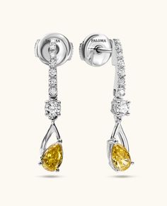 Elegant and timeless, these single-drop earrings feature two fancy yellow diamonds gracefully hanging from a gold bar adorned with pave diamonds. They effortlessly elevate an everyday style or add a touch of glamour to any special occasion. Fine Jewelry Yellow Diamond Earrings, Yellow Diamond Earrings With Diamond Accents, Yellow Diamond Earrings In Fine Jewelry Style, Elegant Yellow Cubic Zirconia Earrings, Elegant Yellow Cubic Zirconia Diamond Earrings, Yellow Diamond Earrings For Formal Occasions, Formal Yellow Diamond Earrings, Yellow Diamond Drop Earrings Fine Jewelry, Classic Yellow Earrings With Brilliant Cut