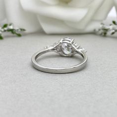 This beautiful ring is made from genuine 925 sterling silver with rhodium plating. Ring details- -The Main stone is an Oval Cut 8x6mm Simulated diamond -Side stones are 4mm by 2mm clear Marquise and 1.5mm Round simulated diamonds -Ring is casted in solid 925 sterling silver with rhodium plating (yellow gold and rose gold plated also available, please check the drop down menu for more options) -The Total face height of the ring measures 8mms and the band width measures 1.6mms -Each ring is handma Round Diamond Ring For Wedding, Round Cut Polished Finish Rings For Promise, Polished Finish Round Cut Promise Ring, Silver Halo Setting Ring For Wedding, Formal Silver Birthstone Ring With Accent Stones, Anniversary Polished Finish Halo Ring, Cubic Zirconia Cluster Ring For Anniversary, Gift Diamond Crystal Ring With Polished Finish, White Gold Cubic Zirconia Rings With Accent Stones