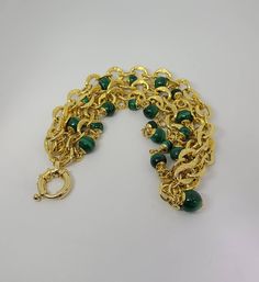 925 Silver Vermeil Textured Italian Malachite Multistrand Link Bracelet Item w# 1231 Clean and in good condition Light wear to plating on clasp. Please review the pictures. 7.75 inch long Green Chain Bracelet Jewelry, Elegant Green Chain Bracelet, Malachite Bracelets With Natural Stones, Malachite Gemstone Bracelet, Elegant Handmade Malachite Bracelets, Gold Malachite Bracelet, Elegant Malachite Bracelet Jewelry, Vintage Multi-strand Gold Jewelry, Elegant Malachite Bracelet