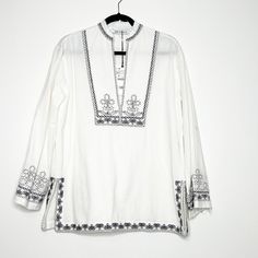 Zara Long Sleeve Tunic Embroidered With Black Designs. The Classic White Tunic. Split V Neckline With Embroidery. Pull On Style Relax Fit Frayed Hem Side Slits Runs Big White Folk Style V-neck Blouse, White V-neck Top With Intricate Embroidery, White V-neck Blouse With Intricate Embroidery, White Embroidered Long Sleeve Top, White Long Sleeve Top With Embroidered Hem, White Long Sleeve Blouse With Embroidered Hem, White Long Sleeve Tops With Geometric Embroidery, White Long Sleeve Blouse With Geometric Embroidery, White Long Sleeve Top With Intricate Embroidery