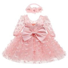 Introducing the Baby Girl Special Occasion Dress, the perfect outfit to make your little one shine on her big day! Whether it's a birthday party, a wedding, or any special occasion, this dress is designed to make her look adorable and feel comfortable.🌟 Made with quality materials, this dress is soft, lightweight, and gentle on your baby's delicate skin. The premium craftsmanship ensures durability, so it can be cherished as a keepsake for years to come.🌸 The dress features a beautiful bodice that adds an elegant touch. The skirt is ethereal and twirl-worthy, making your baby girl feel like a princess. ✨ The attention to detail is what sets this dress apart. Delicate applique butterflies adorn the dress, adding a charming finishing touch. The belted waistline and headband give it a sweet