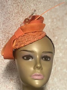 Orange Sequins Felt Half Hat for Church, Wedding, Mother of the Bride, Bridesmaids gift, Head Covering, Tea Parties Hat is trimmed with felt and crinoline bows, hat pin and feather stem. Perfect for any special occasion. The hat pin may vary and is for decorative purposes only. Measurement  5.3 inches circumference (base) Hat can be worn on either side of the head. Gifts for mom, sister, wife, or yourself. Covered Hats by Christian Design Studios Handmade Fitted Hats For Formal Occasions, Handmade Fitted Formal Hats, Formal Fitted Handmade Hats, Handmade Formal Hats, Handmade Adjustable Formal Hats, Elegant Adjustable Fascinator As A Gift, Elegant Mini Hats With Matching Headband For Summer, Elegant Mini Hat With Matching Headband For Summer, Formal Kentucky Derby Fascinator With Matching Headband