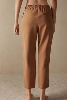 Full-length trousers featuring two pockets, faux back pocket and covered elasticated waist. Business Casual Straight Dress Pants With Pull-on Style, Solid Pants With Side Pockets And Straight Hem, Brown Trousers With Side Pockets, Elastane Dress Pants With Pockets And Straight Hem, Brown Ankle-length Pants For Business Casual, Elastane Trousers With Pockets, Tapered Leg Elastane Pants With Pockets, Brown Straight Pants With Side Pockets, Business Casual Brown Pants With Pockets