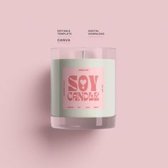 a soy candle on a pink background with the words soy candie written below it