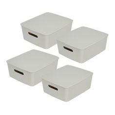 three white storage boxes sitting next to each other