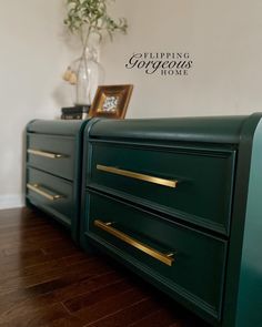 two green dressers with gold handles in a living room