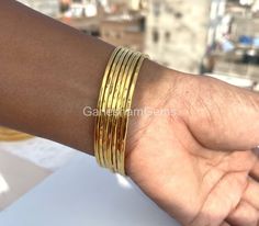 Hammered Bangles Gold Plated bangles 7 Day bangles Stacking bangles Brass bangles Set of 7 bangles Gold Plated For Woman Gift for Her Material : Brass Bracelet Size Inches Circumference/Diameter 7 / 2.23 7.5 / 2.39 8 / 2.55 8.5 / 2.71 9 / 2.87 9.5 / 3 How To Measure Your Wrist Size: Open up your palm to widen your wrist. Place the metal end of tailor's tape in the center of your wrist. Pull the tape over your wrist to where it fits snug. Line up the tape with the metal end piece and read the mea Stackable Bangle Bracelets For Festivals, Festival Stackable Bangles, Stackable Festival Bangles, Festival Stackable Bangle, Stacking Bangles, Handmade Wedding Gifts, Hammered Bangles, Bangles Gold, Bangles Set