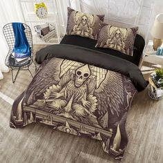 a bed with a skull and angel design on it