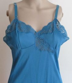 This is a  Vintage Blue Full Nylon Slip, Size 36, Adjustable Satin Straps, Lacy Bodice, Lace Hem, Sears, Made in Canada.  There is no size label but I believe it is a 36, but please refer to the measurements I have taken with garment lying flat: Bust/chest 36-37 in. Waist 34 in. Hip 40 in. Shoulder to hem 42 in. A very pretty slip, and though preowned, in very good condition, clean from my non-smoking and pet-free home. Blue Nylon Top With Built-in Bra, Blue Nylon Tops With Built-in Bra, Size Label, Lace Hem, Favorite Outfit, Bodice, Bathing Beauties, Slip On, Swimming