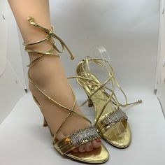 Cute Gold High Heel Sandals With With Wraparound Leg Straps. Rhinestone Detail On Front Strap. 3.5” Heel. Shoes Are Brand New With Slight Try On Marks. Sa-8 Gold Sandals With Rhinestones And Open Heel, Gold Heels With Rhinestones In Synthetic Material, Gold Synthetic Heels With Rhinestones, Gold Closed Toe Sandals With Rhinestones, Gold Sandals With Rhinestones And Ankle Strap, Gold Strappy Heels For Wedding, Gold High Heel Sandals, Gold High Heels, Strappy High Heels Sandals