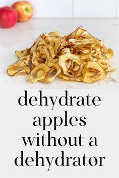 a pile of potato chips sitting on top of a white counter next to an apple