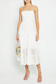 The Robyn Cotton Dress is the perfect blend of comfort and style. Made from a breathable white eyelet lace material, it is both comfy and airy, making it ideal for warm weather. The adjustable waist tie allows for a custom fit, ensuring both comfort and flattering silhouette. White Casual Eyelet Dress, Chic Eyelet Midi Dress, Summer Beach Midi Dress With Eyelet Details, Beach Midi Eyelet Dress, Beach Eyelet Midi Dress, White Eyelet Dress For The Beach, Summer Beach Eyelet Midi Dress, Elegant Eyelet Beach Dress, Chic Vacation Dress With Broderie Anglaise