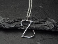 This fun little personalized charm necklace features a sterling silver lowercase letter z charm floating along a sterling silver rolo chain, finished with a lobster clasp. The letter z stands approximately 1 inch (20mm) tall by 1 inch (20mm) wide and is handcrafted by me from sterling silver. If this is a gift? All my pieces come ready for gift-giving- Your piece will come in a gift box. I am happy to include a personalized note- Just write a brief (1-2 sentence) message in 'notes to seller' upo L Necklace Initial Silver, Z Necklace Letter, Z Necklace, Z Pendant, Nickel-free Silver Initial Pendant Jewelry, Nickel-free Sterling Silver Initial Pendant Necklace, Nickel-free Sterling Silver Initial Pendant Jewelry, Personalized Charm Necklace, Lowercase Letter