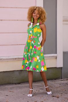 April showers bring May flowers...and these flowers are POPPING with vibrant yellow, pink, magenta and white! This 1960s Mod Tulip print is recreated in stretch rayon in to wear for spring, summer and beyond. Don't be a wallflower and pair this with bold and chunky accessories and a great platform heel! Super vintage i Yellow Spring Dress With Retro Print, Yellow Dress With Retro Print For Spring, Retro Print Summer Dresses For Spring, Spring Garden Party Dress With Retro Print, Chunky Accessories, Bianca Dress, April Showers Bring May Flowers, Trashy Diva, 1960s Mod