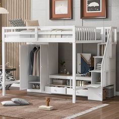 a white loft bed with stairs next to it