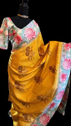 Floral printed pure KANJIVARAM SAREE one of a kind fusion kanjivaram silk saree with gold zari lines throughout the saree with stitched blouse. Easy to drape - fine weave modern kanchi pattu saree. DETAILS AND CARE Colour : Yellow kanchi  Weight : 600 - 800 grams Length : 5.5 m saree + 0.7 m blouse Width : 48 Inches Fabric : Pure Kanjivaram Pattu Plain Silk Craft Description : Kanjivaram, Kanjeevaram Wash Care : Dry Wash Only Shipping Time : 5 - 7 Working days We Ship Worldwide   DISCLAIMER Color : There can be a slight variance in the colors of the products on our site from the actual ones. This is attributed to the reproduction of color by the device you are using or the color settings of your respective device.  Handloom : All our products are handwoven and hence may have slight variati Elegant Multicolor Cotton Silk Pre-draped Saree, Elegant Yellow Pre-draped Saree With Zari Weaving, Gold Raw Silk Pre-draped Saree For Festivals, Festive Gold Art Silk Pre-draped Saree, Festive Gold Pre-draped Cotton Silk Saree, Silk Blouse Piece For Designer Wear During Navratri, Gold Cotton Silk Pre-draped Saree, Gold Pre-draped Saree For Puja And Festivals, Elegant Yellow Saree For Transitional Season