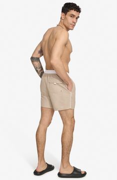 Soak up the sun in these recycled-fiber swim trunks built with quick-drying properties and UPF 40+ sun protection. 5" inseam (size Medium) Elastic/drawstring waist Front slant pockets; back patch pocket Lined 100% REPREVE polyester REPREVE recycled polyester is made from 100% post-consumer recycled plastic bottles Machine wash, tumble dry Imported White Swim Trunks For Beachwear, White Beachwear Swim Trunks For Outdoor, White Swim Trunks For Outdoor Beachwear, White Summer Swimwear For Outdoor, White Summer Outdoor Swimwear, Relaxed Fit Nylon Swim Trunks For Beachwear, Summer Cotton Swim Trunks With Upf 50+, Nylon Swim Trunks With Drawstring For Vacation, Nylon Swim Trunks With Functional Drawstring For Vacation