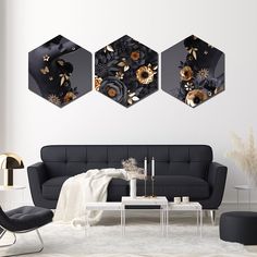 three black and gold floral paintings in a living room